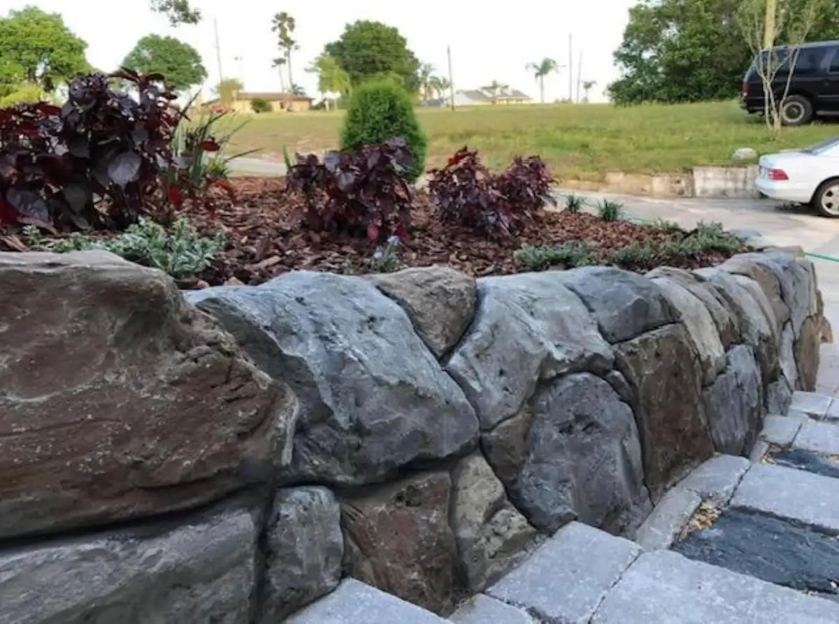 Hand-sculpted custom hardscape by Boulder Legacies showing detailed concrete texturing and natural stone replication