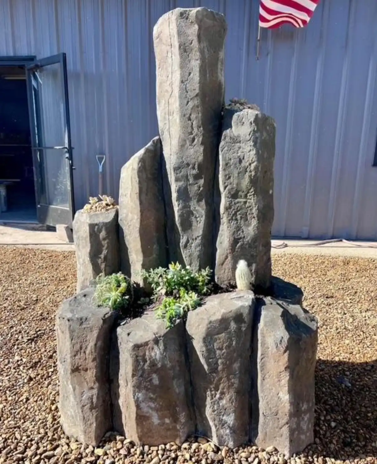 Custom hardscape feature with integrated planting beds