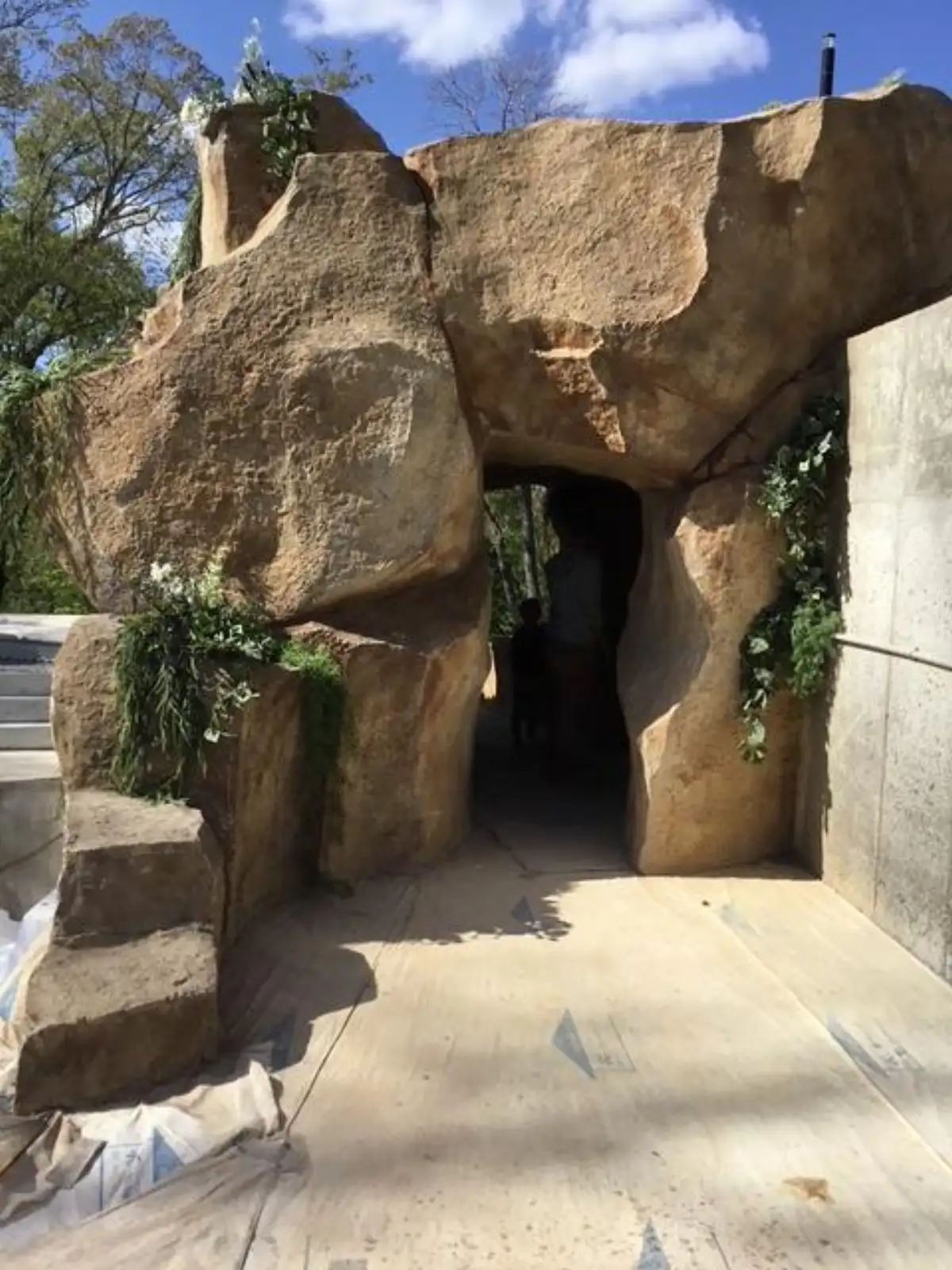 Multi-tier custom pool waterfall with stream bed and natural boulder texturing