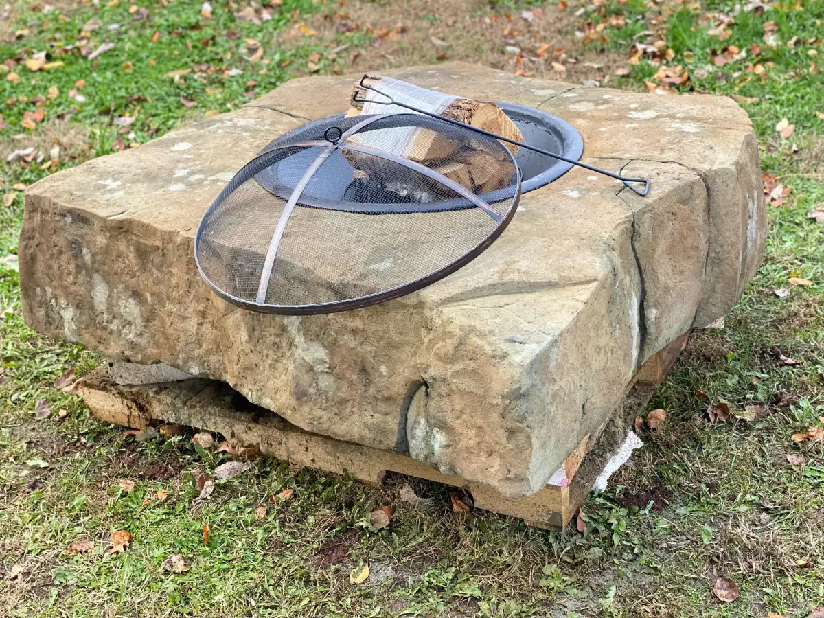 Custom fire feature with natural stone texture and flame detail