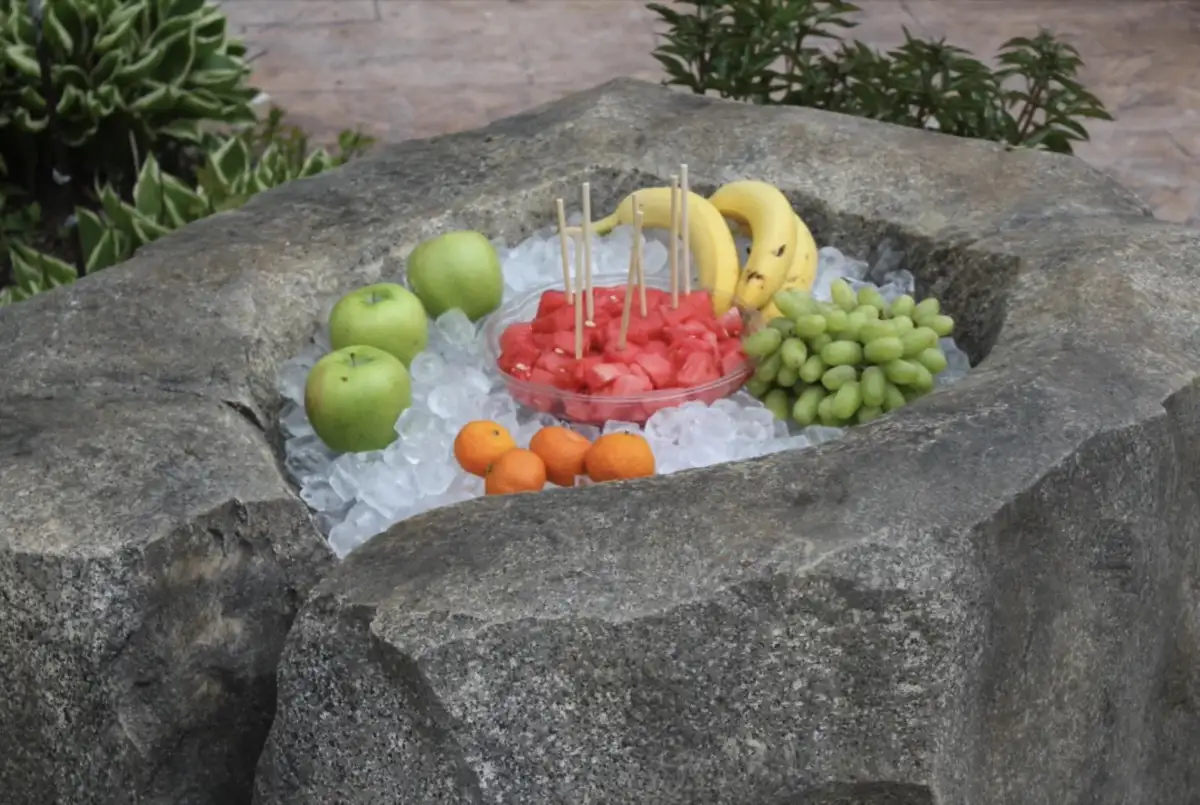 Architectural fire feature integrated into sculpted landscape