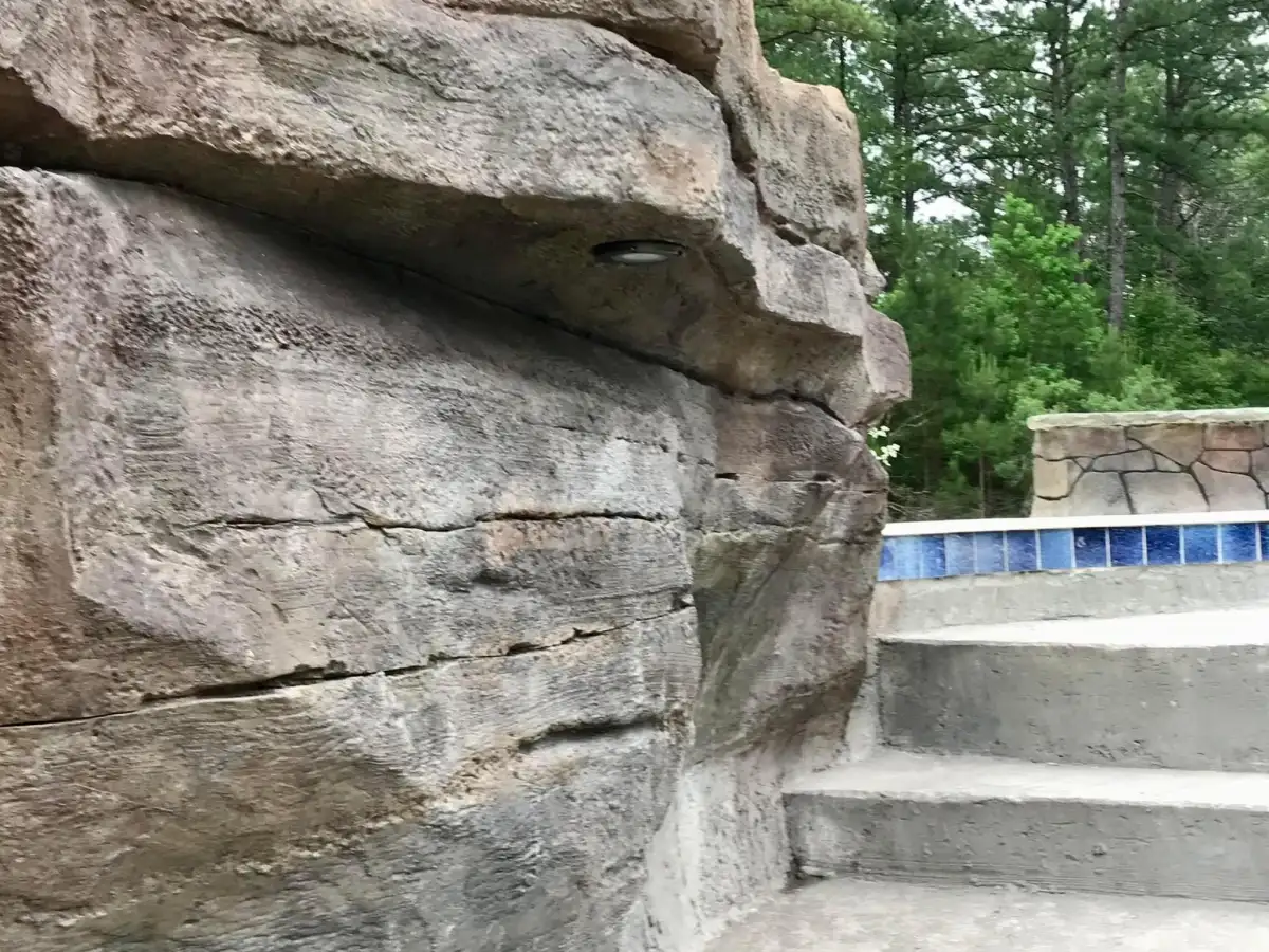 Boulder Legacies grotto entrance with sculpted rock formations and water features