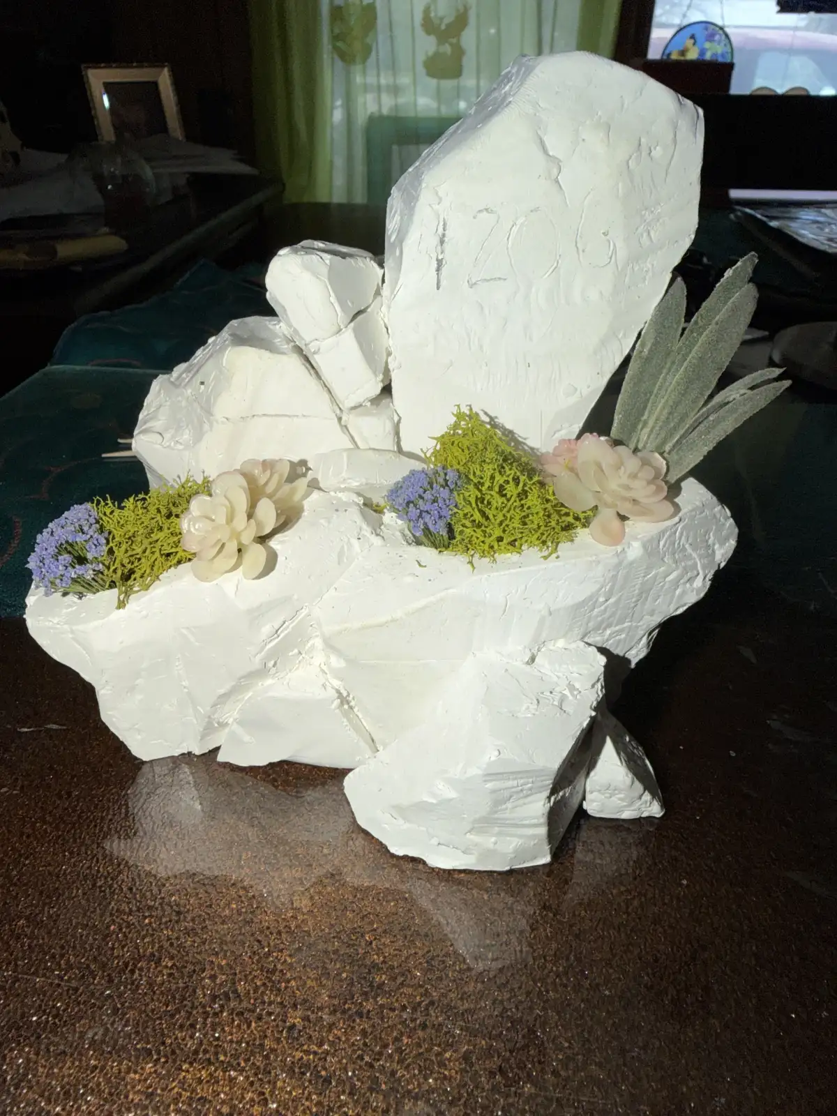 Clay maquette of address rock sculpture with property number detail
