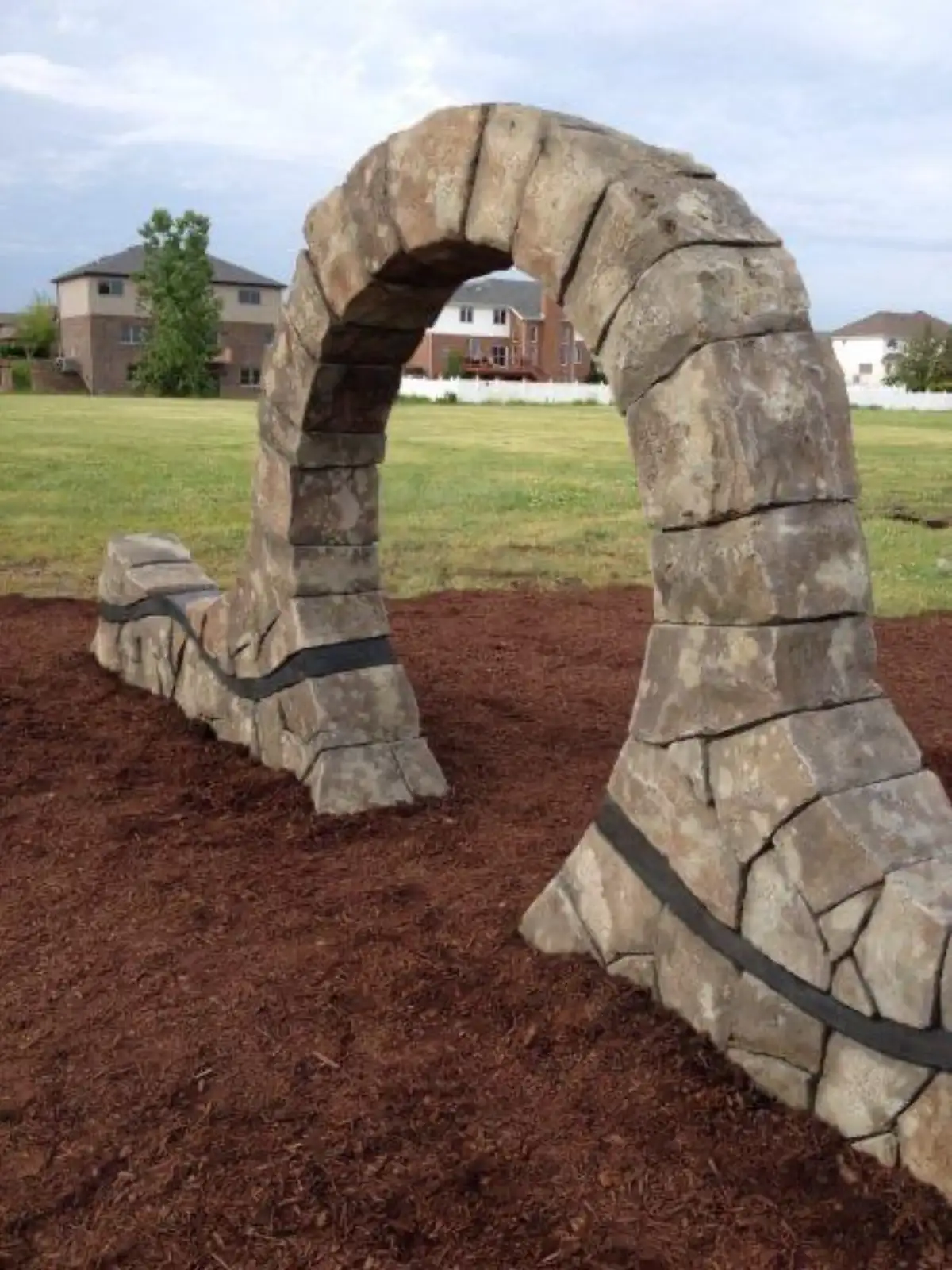 Moongate circular stone archway with landscape backdrop