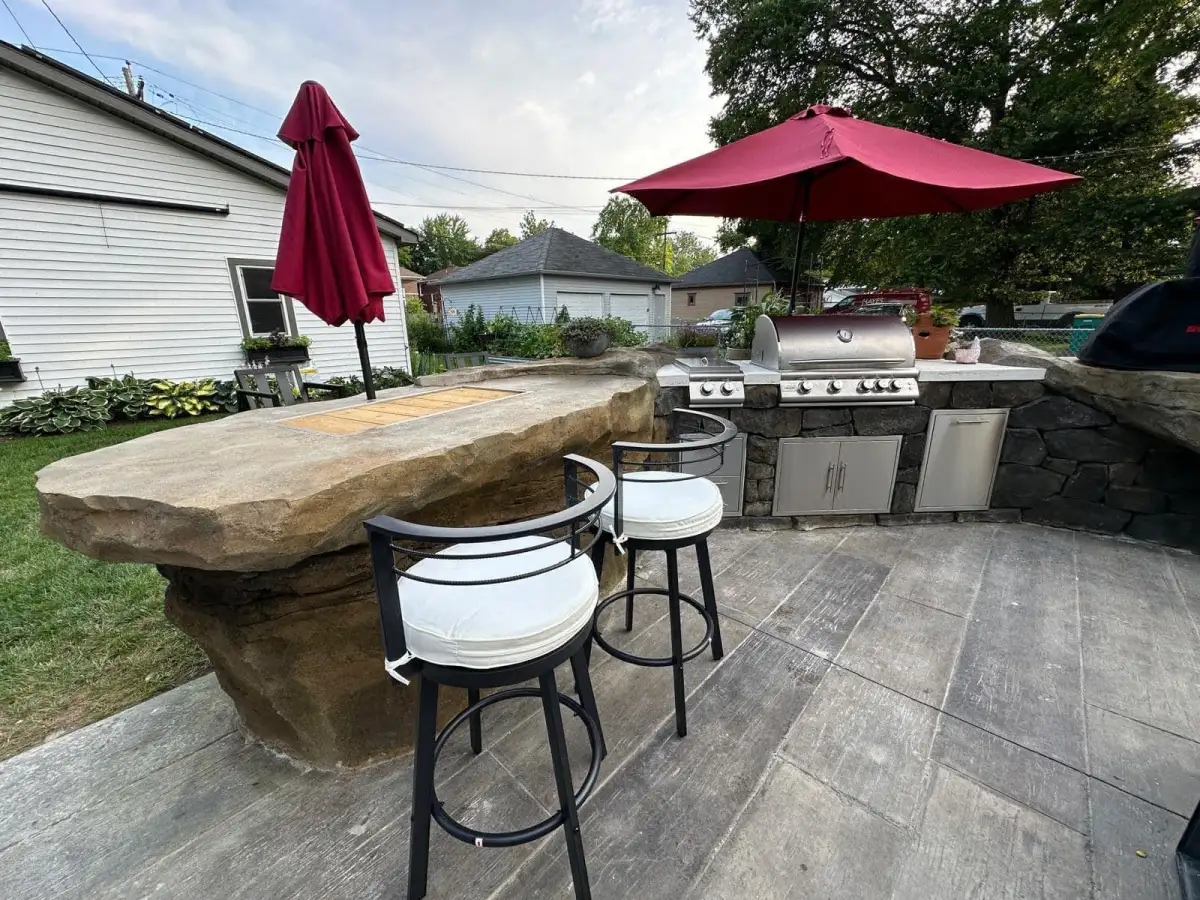 Boulder Legacies outdoor bar and grill station built into sculpted rock formation