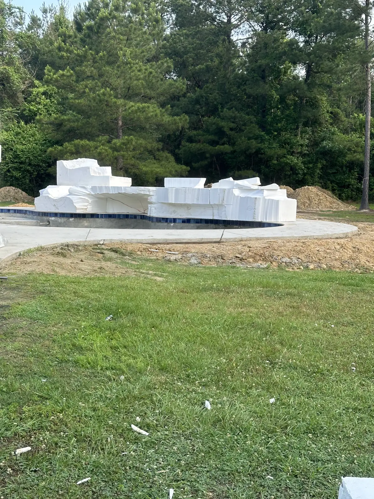 Boulder Legacies EPS foam core structure positioned at pool site during waterfall construction